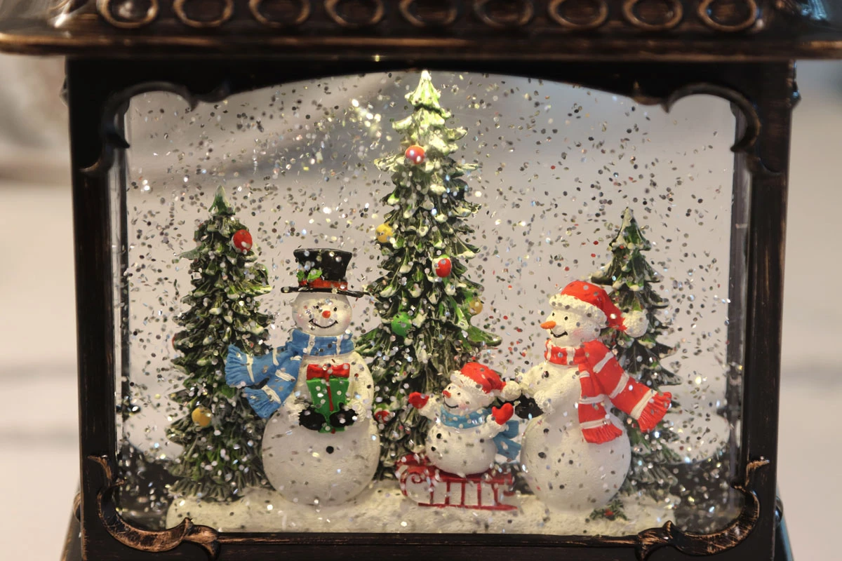 11 Inch Decorative Bronze Water Lantern With Snow Family Sledding In Swirling Glitter 5 11 Inch Decorative Bronze Water Lantern With Snow Family Sledding In Swirling Glitter - Image 3