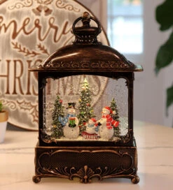 11 Inch Decorative Bronze Water Lantern With Snow Family Sledding In Swirling Glitter