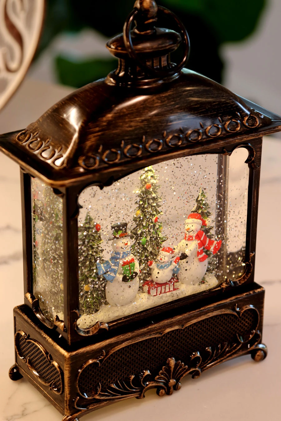 11 Inch Decorative Bronze Water Lantern With Snow Family Sledding In Swirling Glitter 4 11 Inch Decorative Bronze Water Lantern With Snow Family Sledding In Swirling Glitter - Image 2