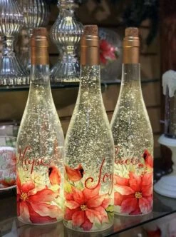 Lighted Wine Bottle With Swirling Glitter Joy Poinsettia Design With Cardinals Snow Globe -Battery Operated Candles Shop 2548120 3 bottles