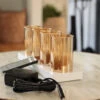 Rechargeable Moving Flame Set Of 4 Gold Glass Votives With Charging Base And Remote 1 Rechargeable Moving Flame Set Of 4 Gold Glass Votives With Charging Base And Remote -Battery Operated Candles Shop gold glass votives 2